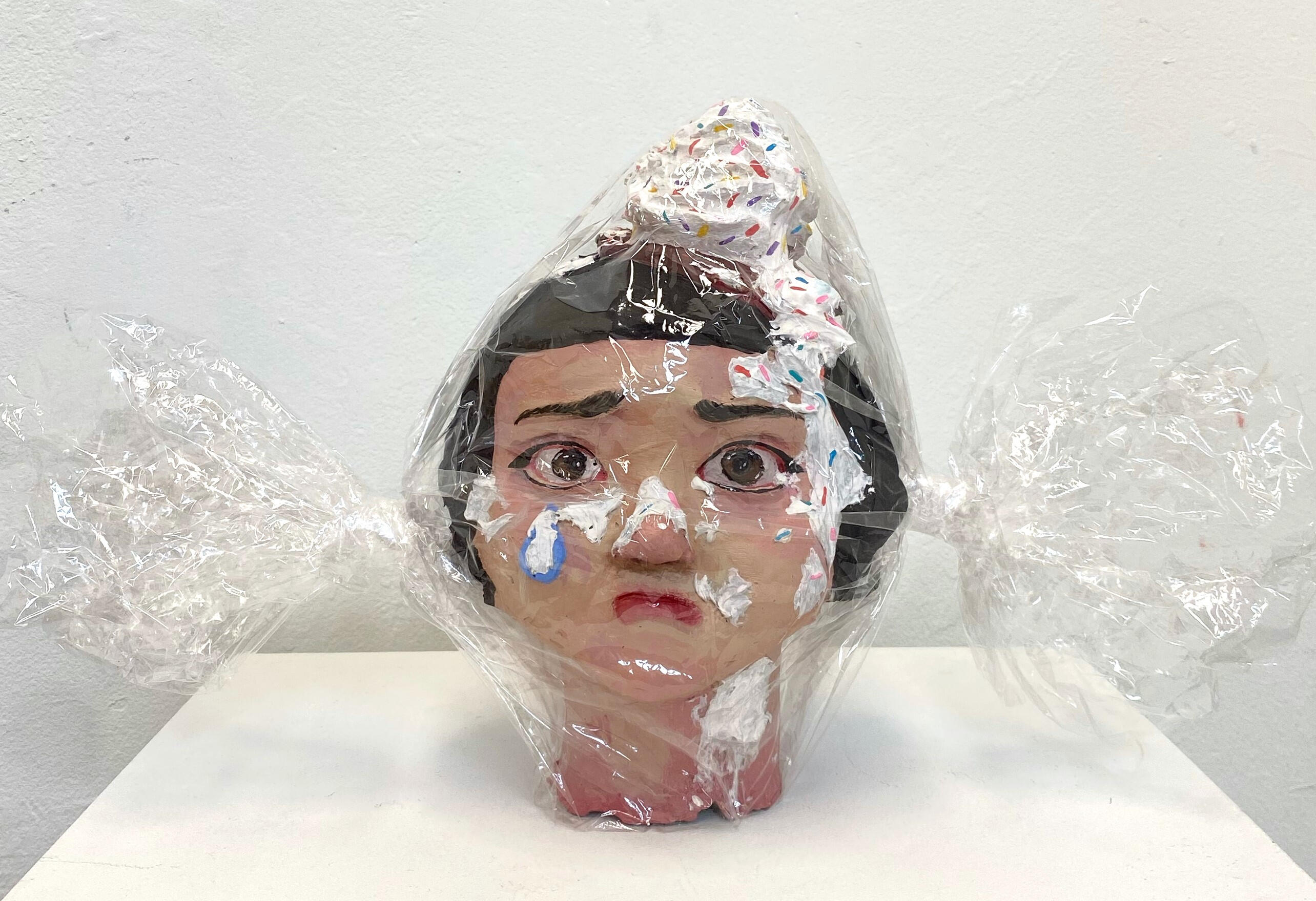 Sweet Girl, 2025, acrylic on bondo and cellophane, 17 x 10.5 x 7.5 in